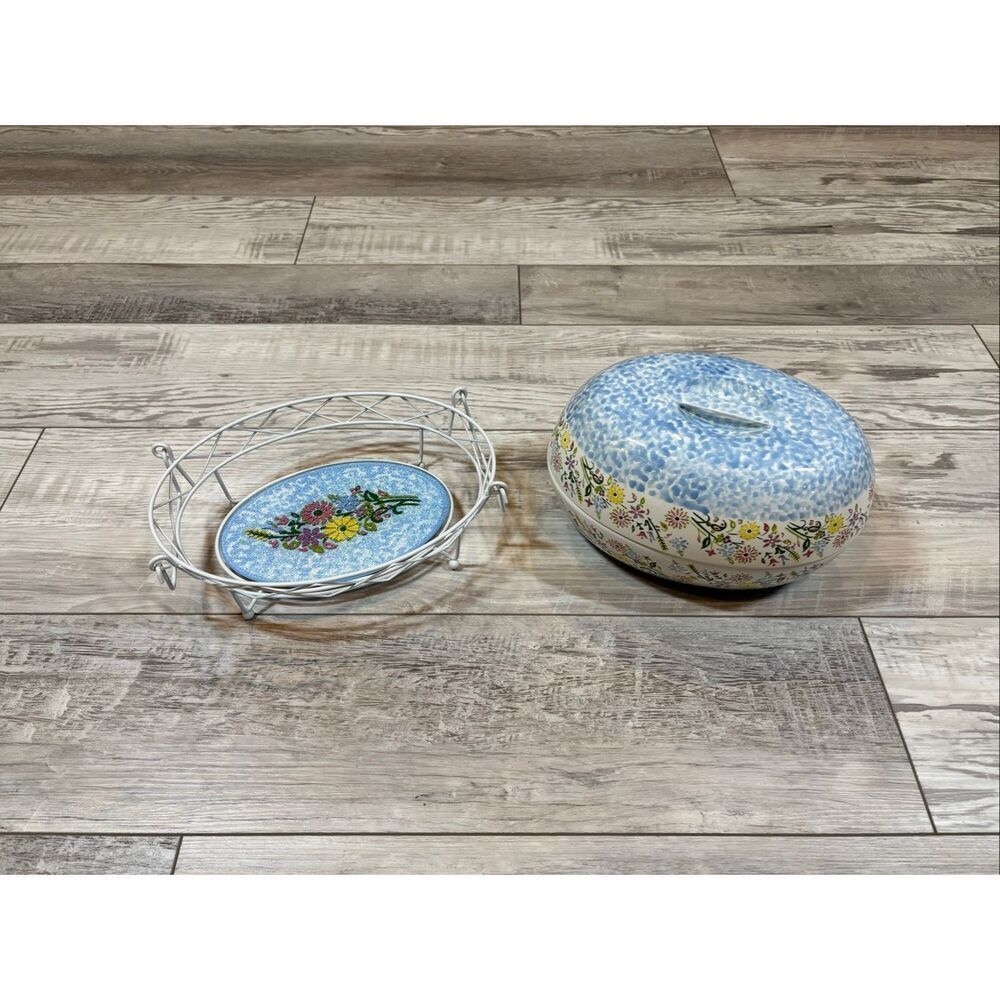 Temp-tations Ovenware by Tara Blue oval covered casserole dish with a metal stan